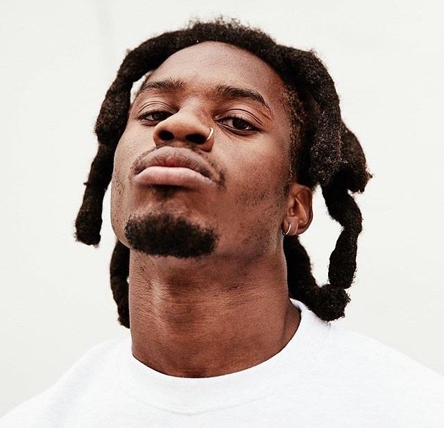 Headshot of Florida rapper Denzel Curry with a clean white background